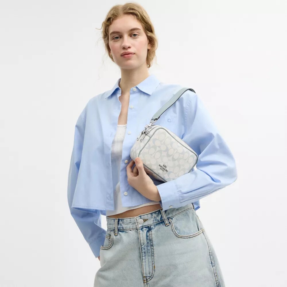 Mini sac bandoulière Carey en Signature Canvas