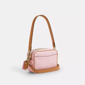 Mini sac bandoulière Carey en Signature Canvas avec Charms