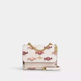 Mini sac bandoulière Klare avec imprimé bonbon