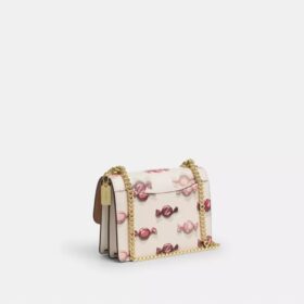 Mini sac bandoulière Klare avec imprimé bonbon