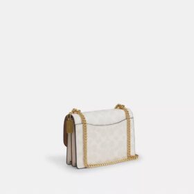 Mini sac bandoulière Klare en Signature Canvas