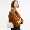 Mini sac bandoulière Klare en Signature Canvas