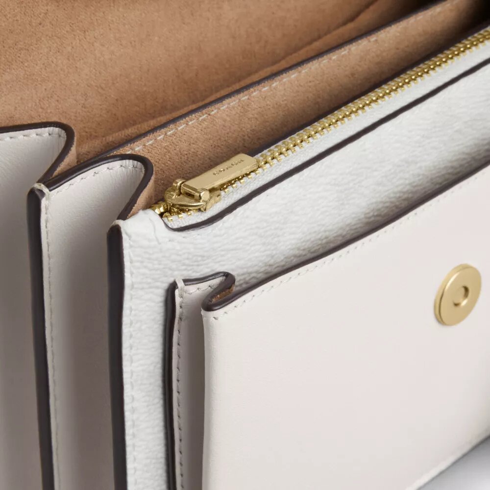 Mini sac bandoulière Klare en Signature Canvas