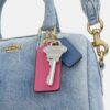 Mini sac bandoulière Rowan en denim usé avec Charms
