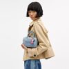 Mini sac bandoulière Rowan en denim usé avec Charms