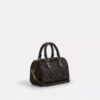 Mini sac bandoulière Rowan en Signature Canvas avec Charms