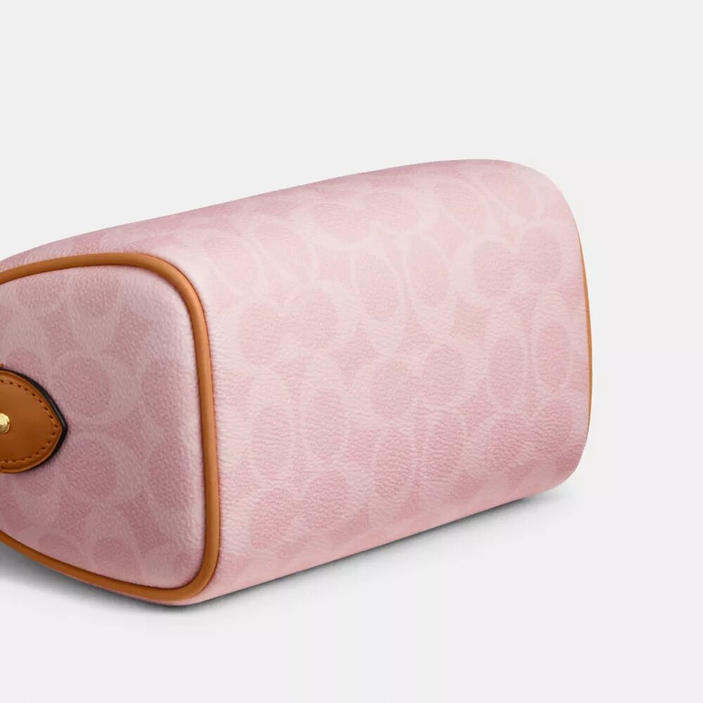 Mini sac bandoulière Rowan en Signature Canvas avec Charms