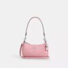Mini sac bandoulière Teri en cuir emblématique avec breloque en forme de cœur