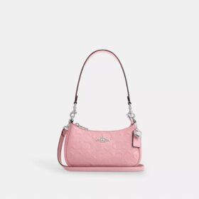 Mini sac bandoulière Teri en cuir emblématique avec breloque en forme de cœur