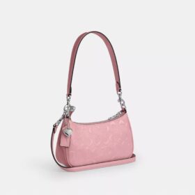 Mini sac bandoulière Teri en cuir emblématique avec breloque en forme de cœur