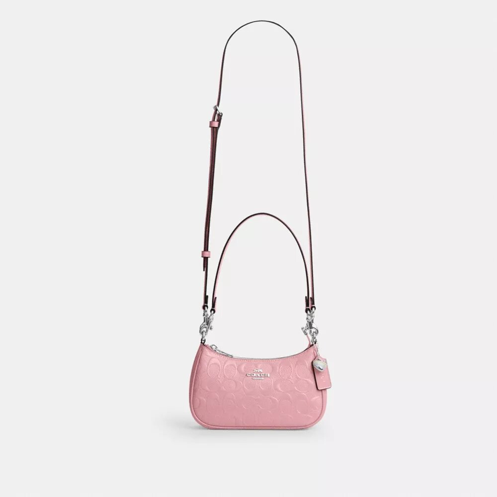 Mini sac bandoulière Teri en cuir emblématique avec breloque en forme de cœur