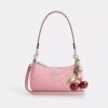 Mini sac bandoulière Teri en cuir emblématique avec breloque en forme de cœur