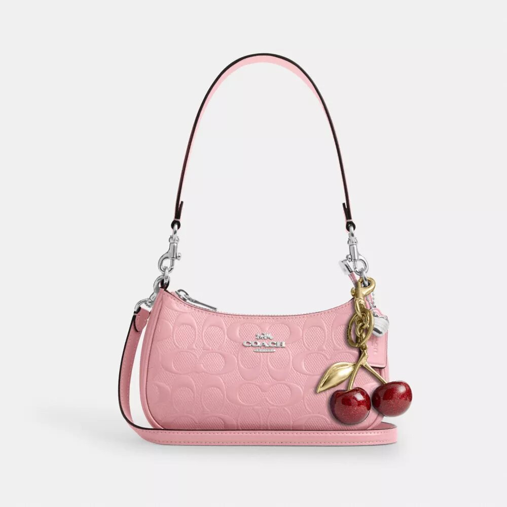 Mini sac bandoulière Teri en cuir emblématique avec breloque en forme de cœur