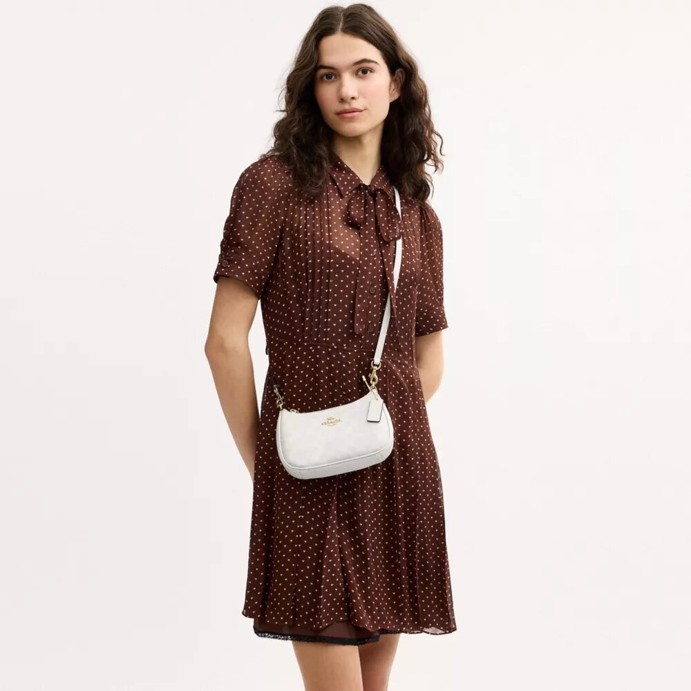 Mini sac bandoulière Teri en Signature Canvas