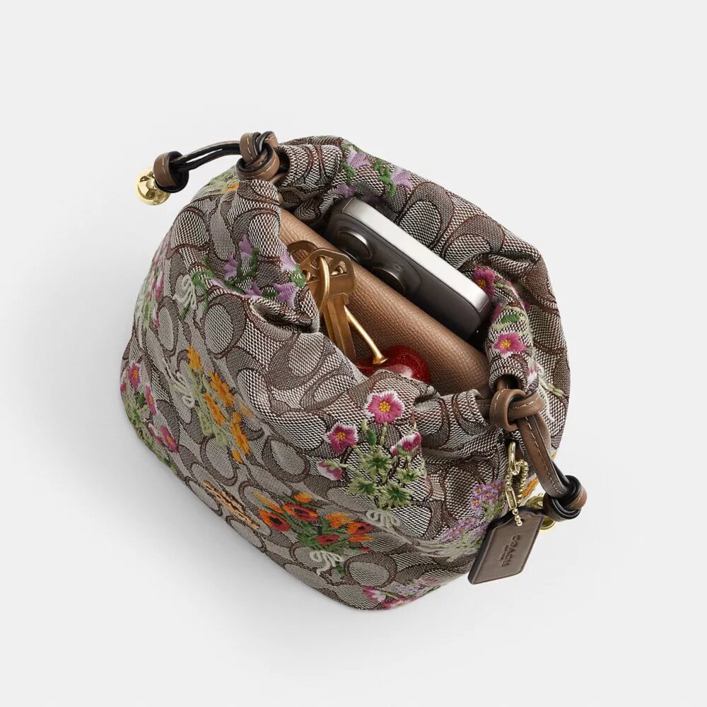 Mini-sac à cordon Faye en jacquard emblématique avec broderie florale