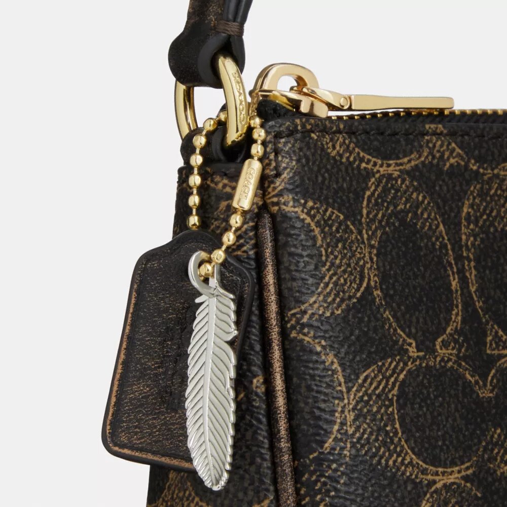 Nolita 19 en Signature Canvas avec Charms
