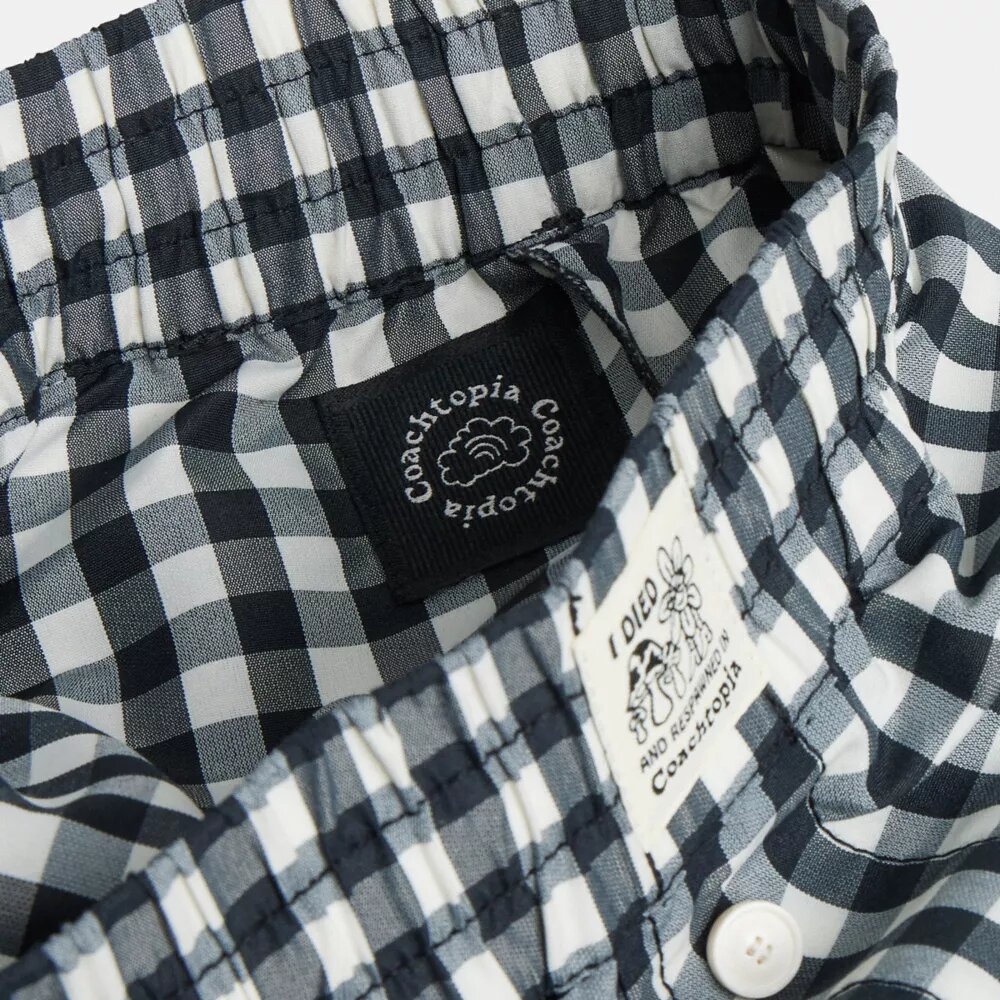 Pantalon à carreaux « Loop » de Coachtopia