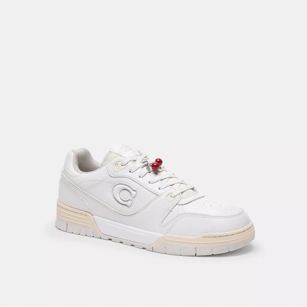 Petit charm « chaussure cerise »