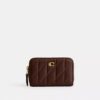 Petit porte-cartes indispensable à fermeture éclair avec matelassage en forme de coussin
