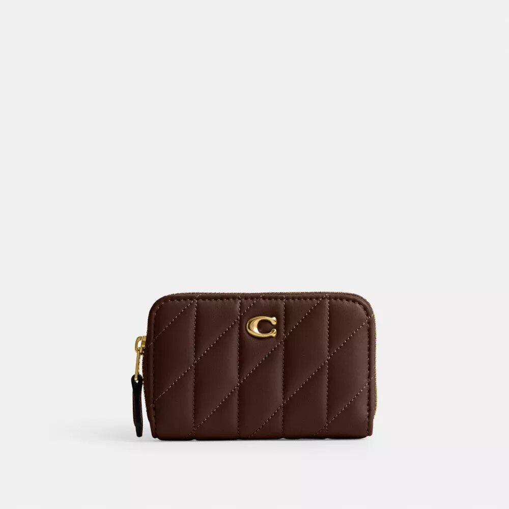 Petit porte-cartes indispensable à fermeture éclair avec matelassage en forme de coussin