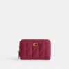 Petit porte-cartes indispensable à fermeture éclair avec matelassage en forme de coussin