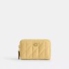 Petit porte-cartes indispensable à fermeture éclair avec matelassage en forme de coussin