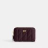 Petit porte-cartes indispensable à fermeture éclair avec matelassage en forme de coussin