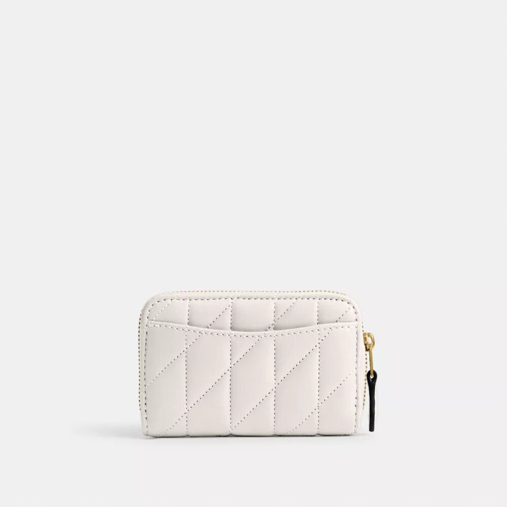Petit porte-cartes indispensable à fermeture éclair avec matelassage en forme de coussin