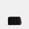 Petit porte-cartes indispensable à fermeture éclair avec matelassage en forme de coussin
