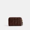 Petit porte-cartes indispensable à fermeture éclair avec matelassage en forme de coussin