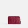 Petit porte-cartes indispensable à fermeture éclair avec matelassage en forme de coussin