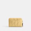 Petit porte-cartes indispensable à fermeture éclair avec matelassage en forme de coussin