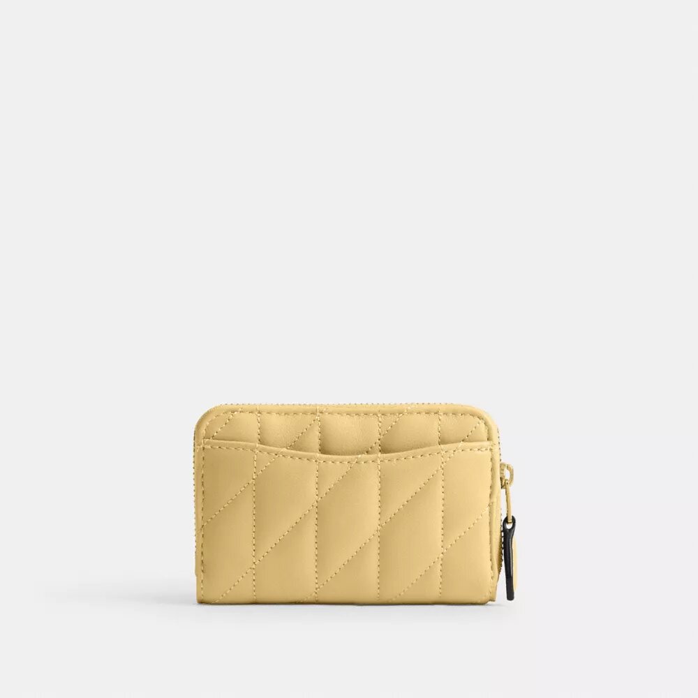 Petit porte-cartes indispensable à fermeture éclair avec matelassage en forme de coussin