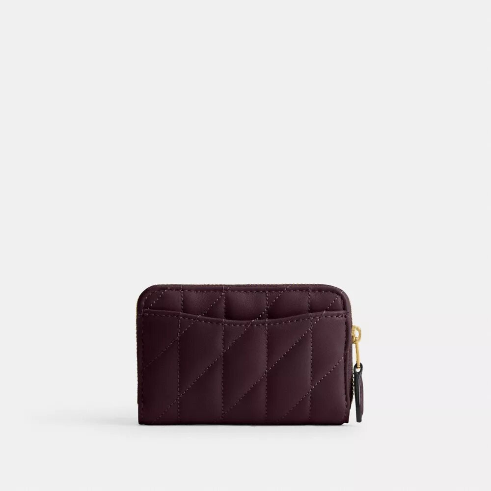 Petit porte-cartes indispensable à fermeture éclair avec matelassage en forme de coussin