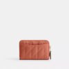 Petit porte-cartes indispensable à fermeture éclair avec matelassage en forme de coussin