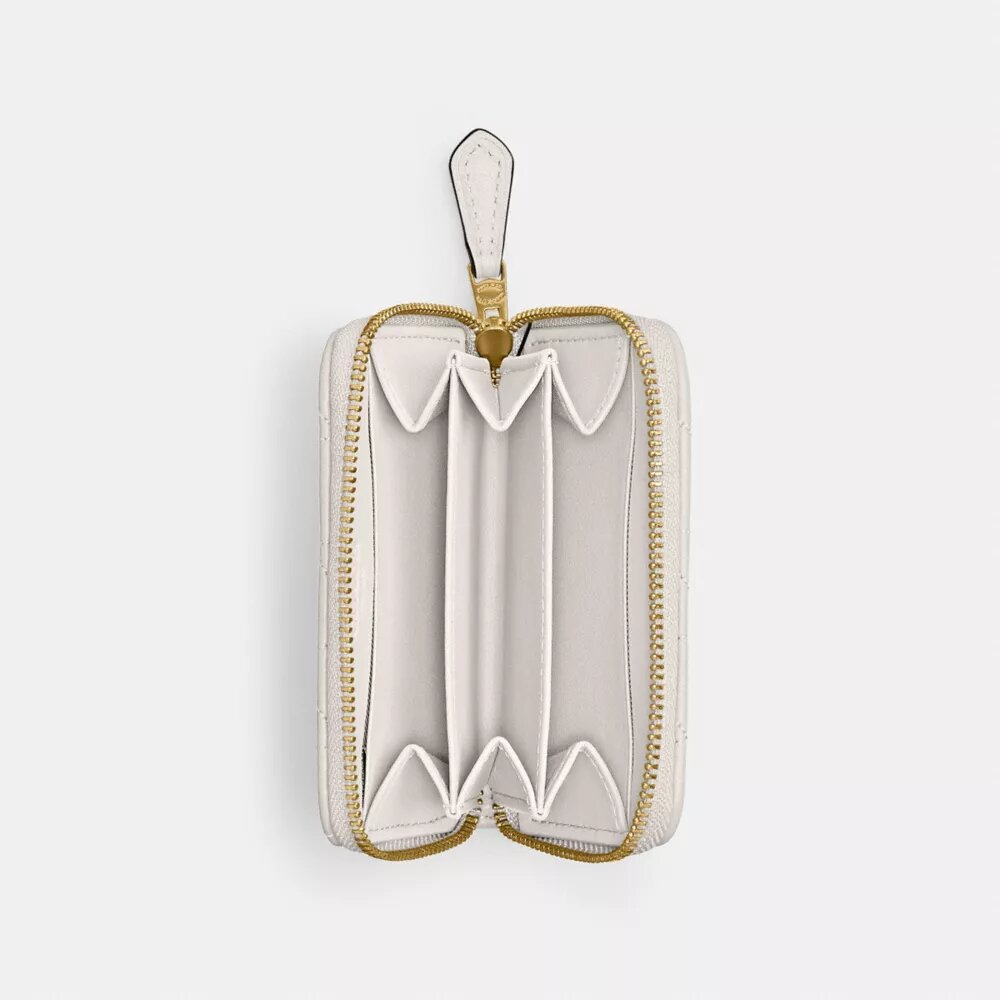 Petit porte-cartes indispensable à fermeture éclair avec matelassage en forme de coussin