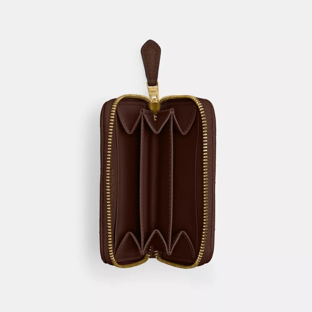 Petit porte-cartes indispensable à fermeture éclair avec matelassage en forme de coussin