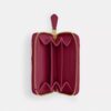 Petit porte-cartes indispensable à fermeture éclair avec matelassage en forme de coussin