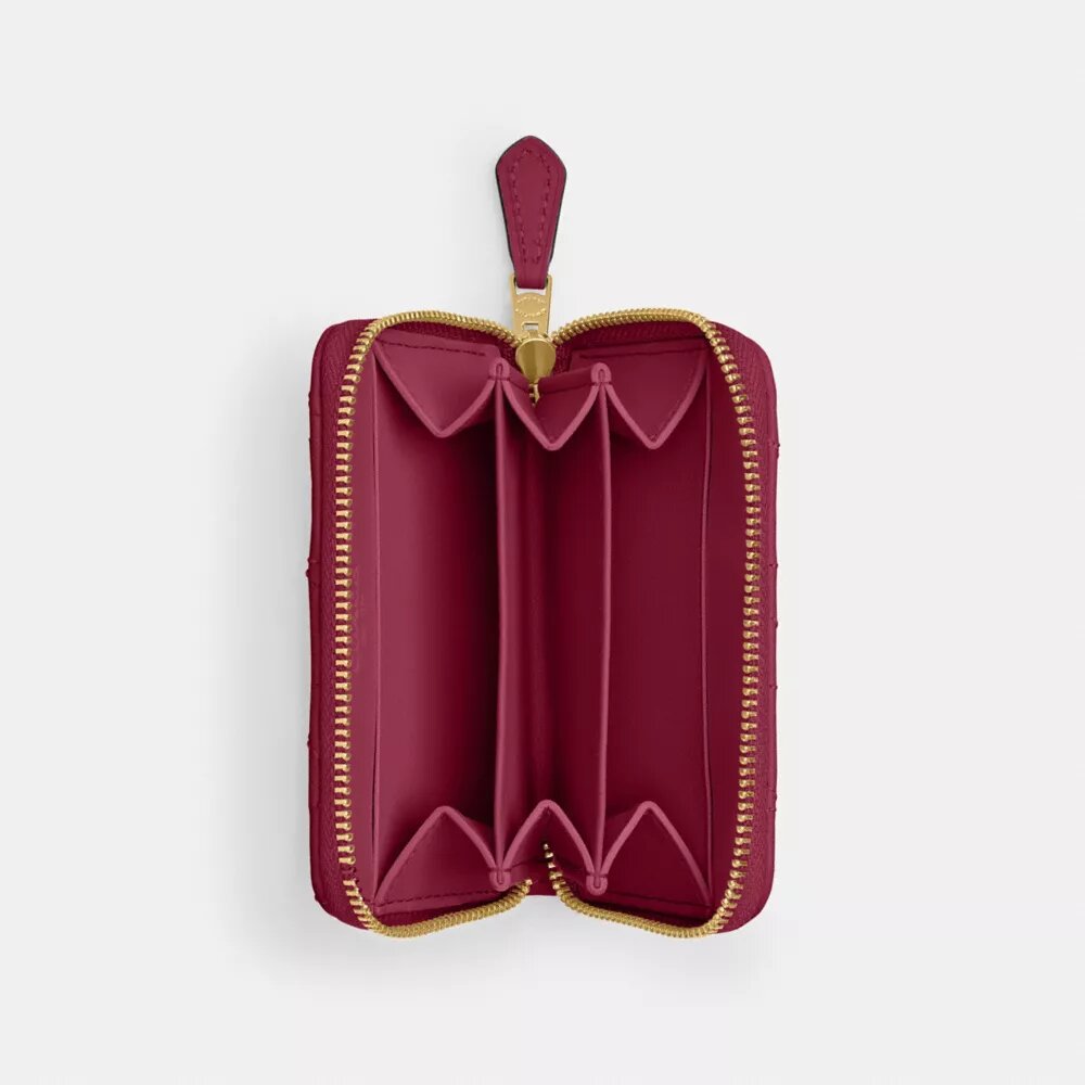 Petit porte-cartes indispensable à fermeture éclair avec matelassage en forme de coussin