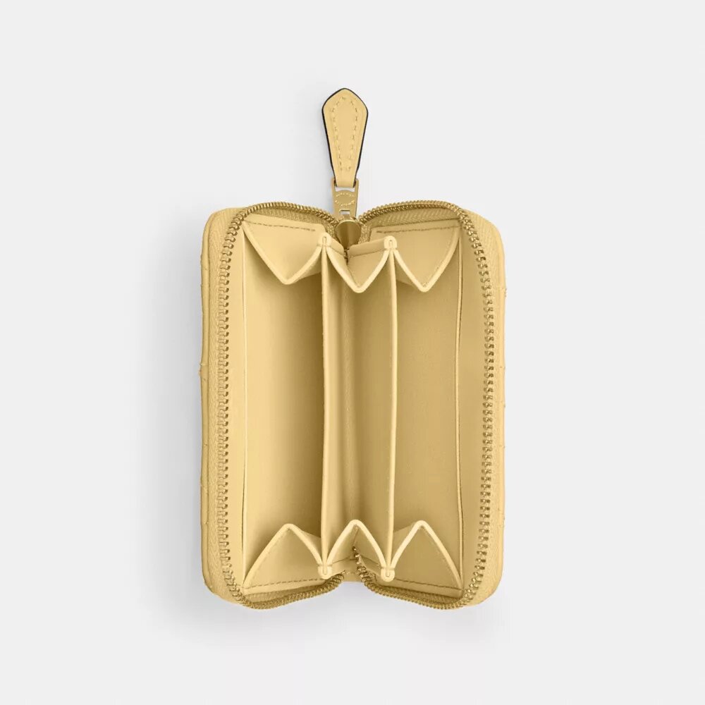 Petit porte-cartes indispensable à fermeture éclair avec matelassage en forme de coussin