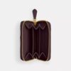 Petit porte-cartes indispensable à fermeture éclair avec matelassage en forme de coussin