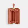 Petit porte-cartes indispensable à fermeture éclair avec matelassage en forme de coussin