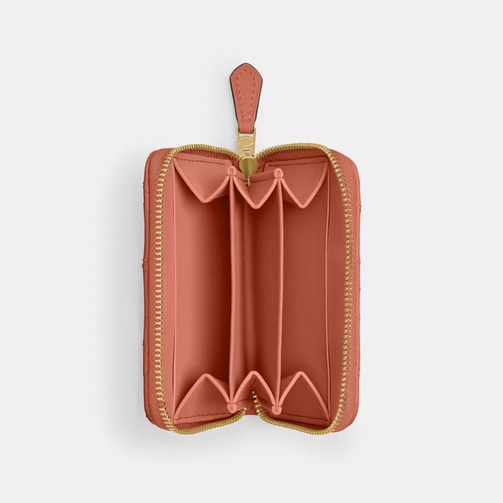 Petit porte-cartes indispensable à fermeture éclair avec matelassage en forme de coussin
