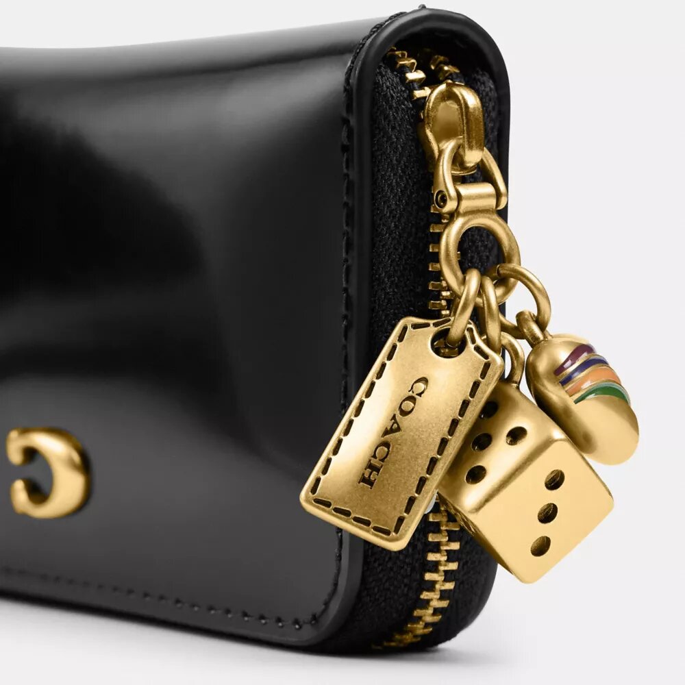 Petit portefeuille zippé Essential avec Charms
