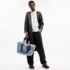 Petit sac cabas « Tour » en denim « Loved » avec Charms