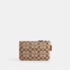 Petite pochette dragonne Essential en jacquard emblématique