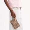 Petite pochette dragonne Essential en jacquard emblématique