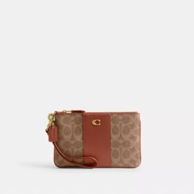 Petite pochette dragonne Essential en Signature Canvas