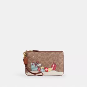 Petite pochette dragonne Essential en Signature Canvas avec cadeaux de Noël