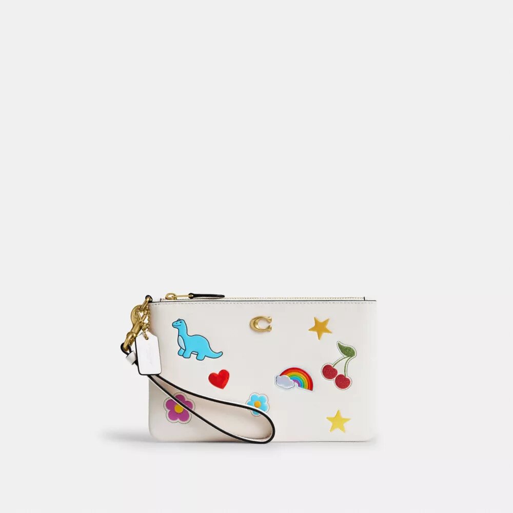 Petite pochette dragonne indispensable à imprimé autocollants